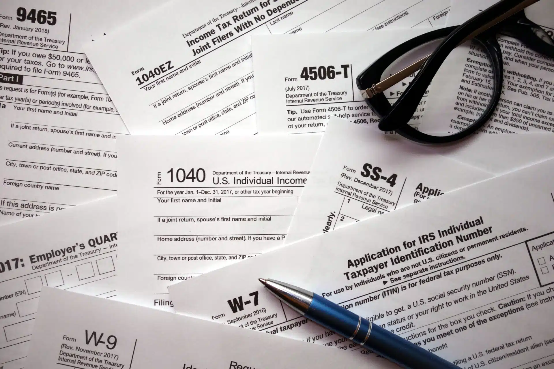 Tax documents and calculator on a desk